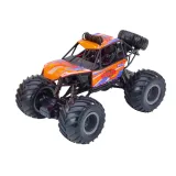 Zbliżenie na amortyzatory i gumowe koła auta zdalnie sterowanego RC