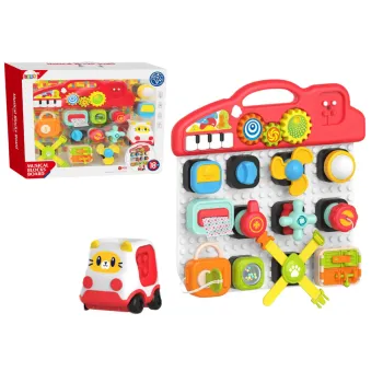 Interaktywny panel sensoryczny dla dzieci z kolorowym pianinkiem i elementami edukacyjnymi