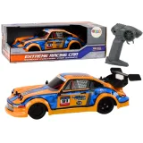 Pomarańczowe autko RC drift z gumowymi kołami widok z boku