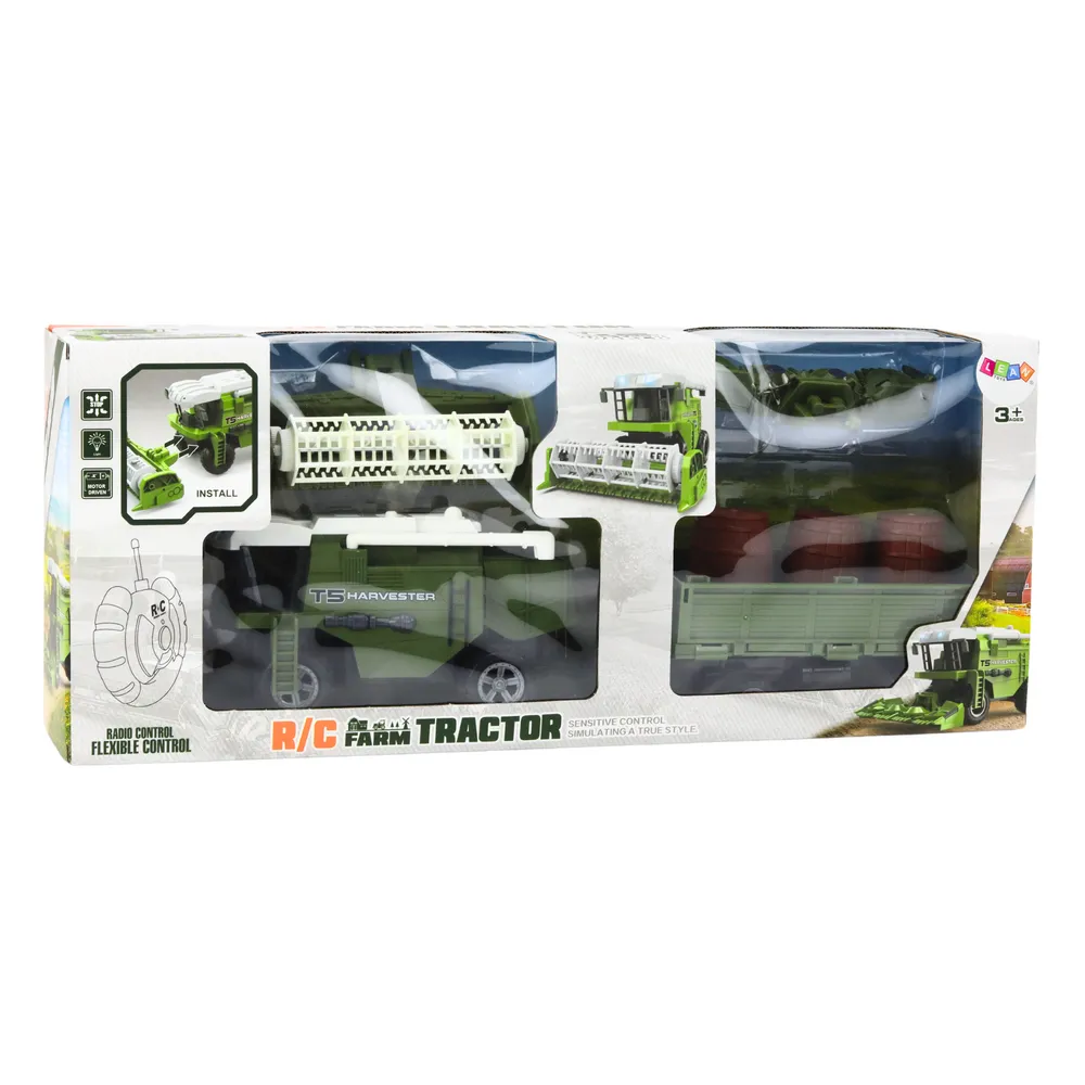 Zestaw z kombajnem RC, przyczepą i pilotem widoczny na białym tle