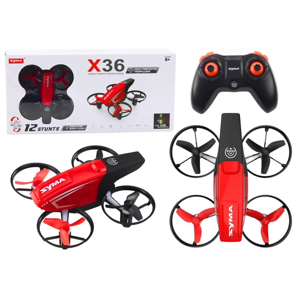 Czerwony dron RC X36 SYMA w locie z pilotem widoczny z boku