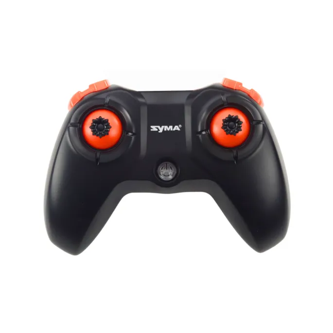 Dron RC X36 SYMA podczas startu na zewnątrz w promieniach słońca