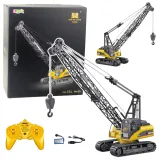 RC dźwig gąsienicowy Huina 1:14 z żółtą kabiną na białym tle