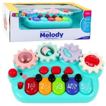 Interaktywne pianinko dla dzieci niebieskie z kołami zębatymi, widok z góry