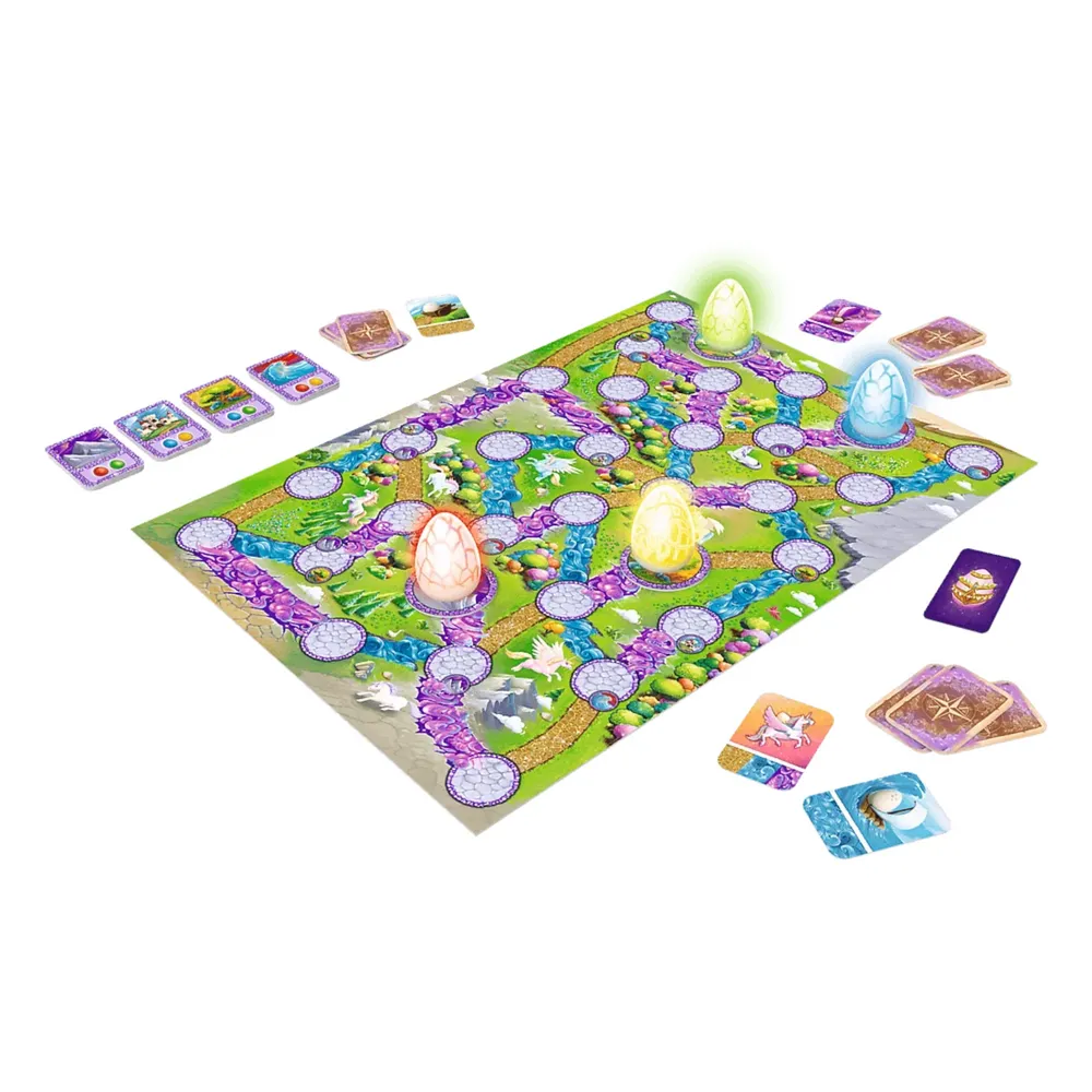 Zbliżenie na karty i planszę gry rodzinnej Magajaja Unicorns Trefl