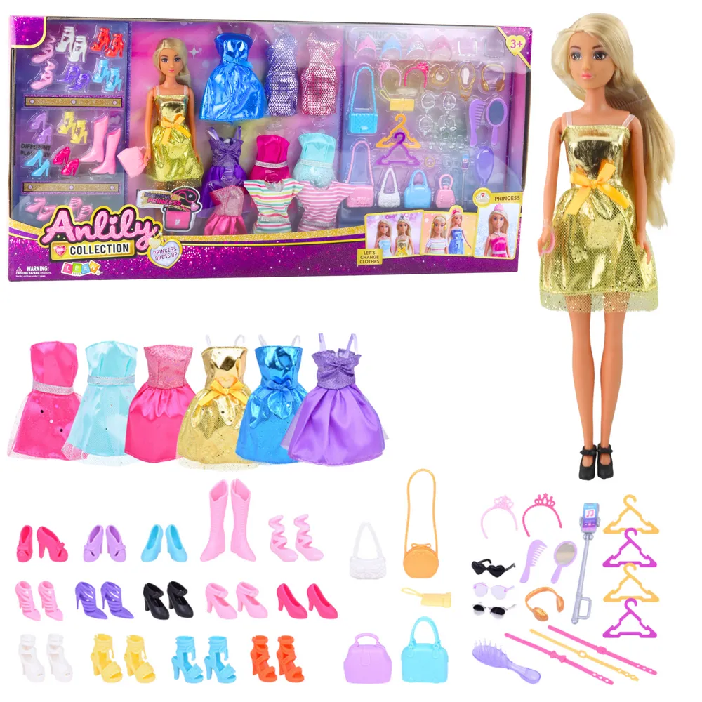 Lalka Anlily z długimi włosami i złotą sukienką na tle akcesoriów