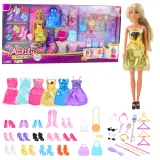 Lalka Anlily z długimi włosami i złotą sukienką na tle akcesoriów