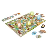 Zawartość gry rodzinnej Magajaja Dinosaurs: plansza, karty i świecące jajka