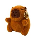 Funkcjonalny beżowy plecak miejski Kapibara z przypinkami i brelokiem