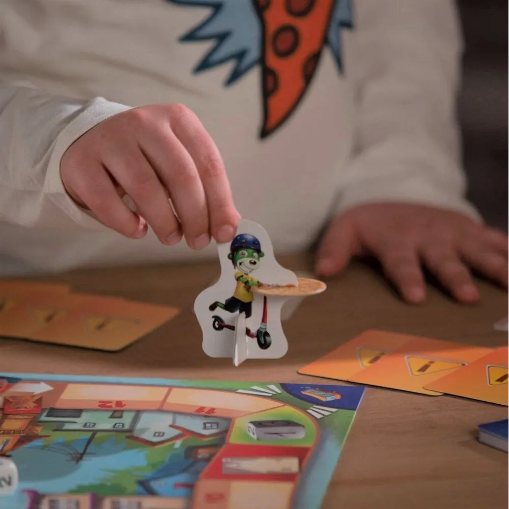 Rodzina bawiąca się grą planszową Cztery Sery Trefliki