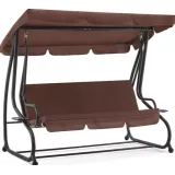 Brązowa huśtawka ogrodowa z funkcją leżanki na tle zielonego ogrodu