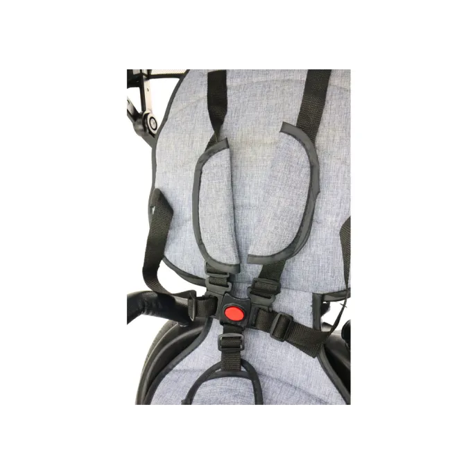 Trójkołowy rower PRO550 szary podczas spaceru w parku dla dzieci