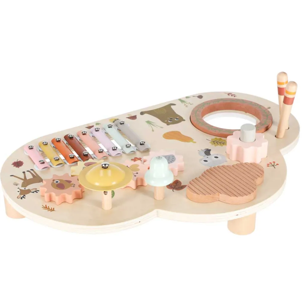 zestaw edukacyjny z bębenkiem, dzwonkiem i cymbałkami na drewnianym stoliku