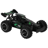 Dynamiczne zdjęcie auta RC w trakcie jazdy po nierównościach na podjeździe