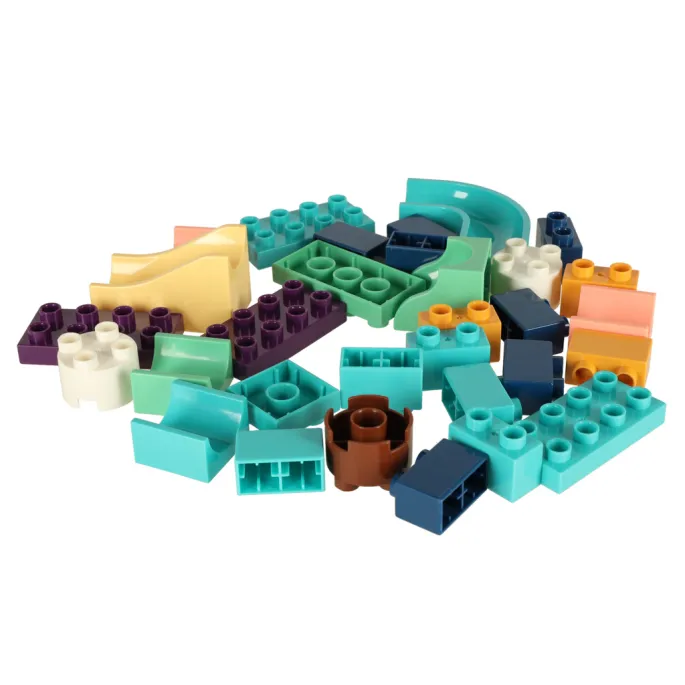 Kolorowe kulki na gotowym torze kulkowym z dinozaurami