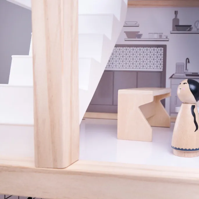 Sypialnia w domku dla lalek z łóżkiem, szafą i stolikiem