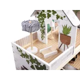 Oświetlenie LED w domku dla lalek w stylu boho, widok nocą