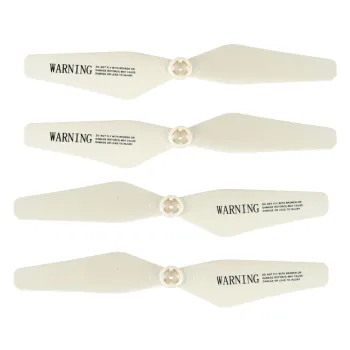 Biały dron SYMA Z3 startuje z powierzchni trawy na zewnątrz