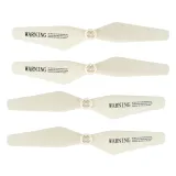 Biały dron SYMA Z3 startuje z powierzchni trawy na zewnątrz