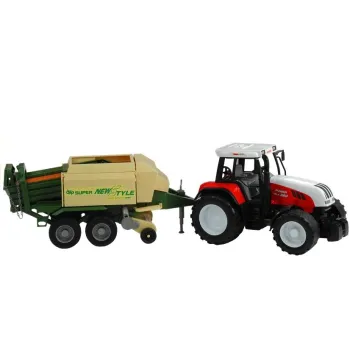 Zielony traktor z obszerną przyczepą i ruchomymi elementami