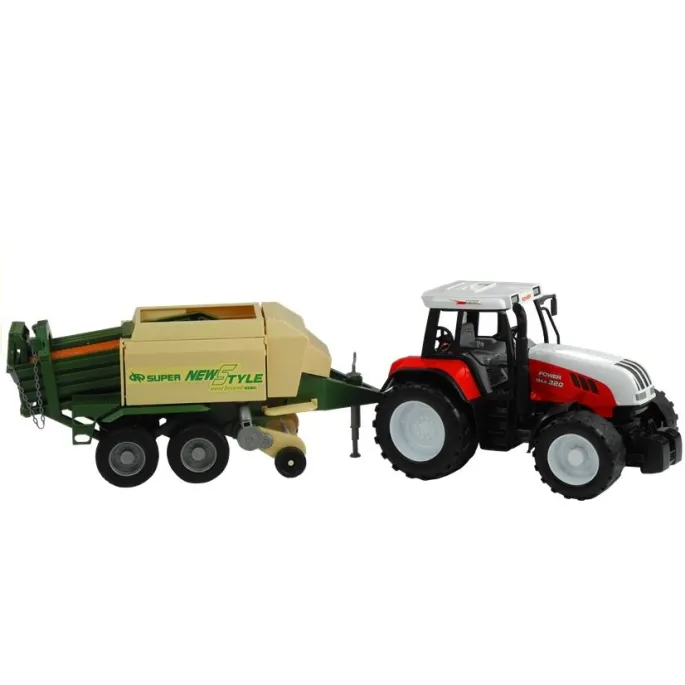 Zielony traktor z obszerną przyczepą i ruchomymi elementami