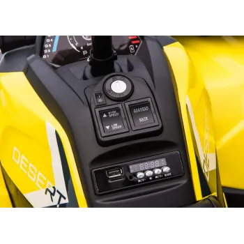 Widok z boku na żółty quad elektryczny przeznaczony dla dzieci