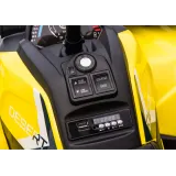 Widok z boku na żółty quad elektryczny przeznaczony dla dzieci