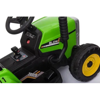 Widok z boku: traktor elektryczny XMX611 z przyczepą w akcji