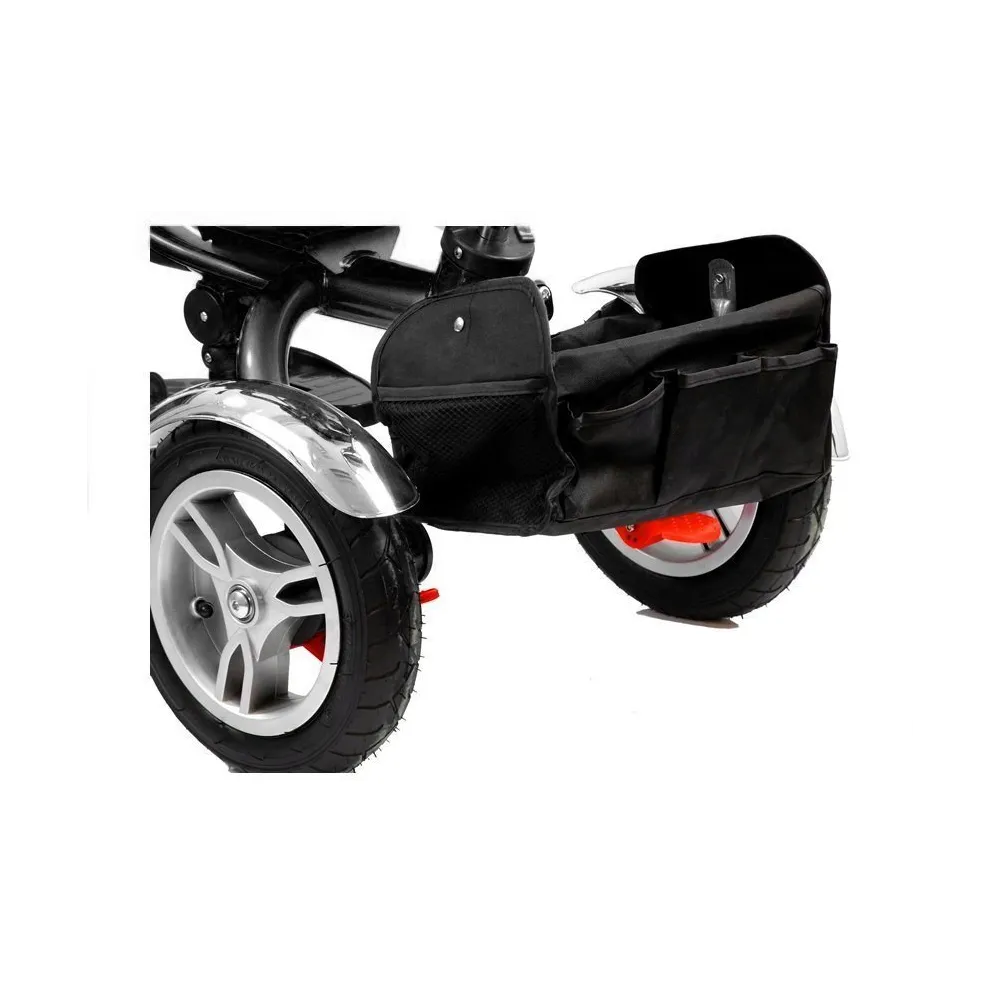 Nowoczesny rower trójkołowy PRO500 czerwony prezentowany na zewnątrz