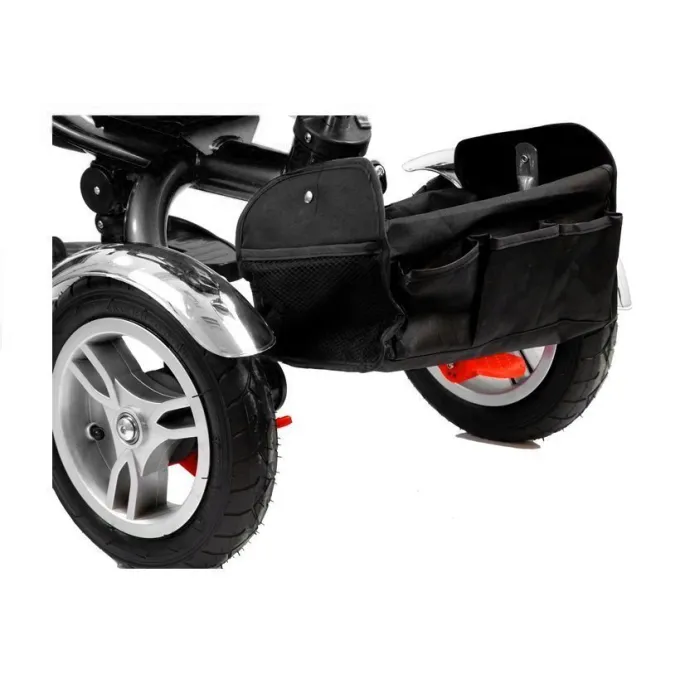 Nowoczesny rower trójkołowy PRO500 czerwony prezentowany na zewnątrz