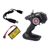 pilot sterujący do auta terenowego rc leżący obok pojazdu