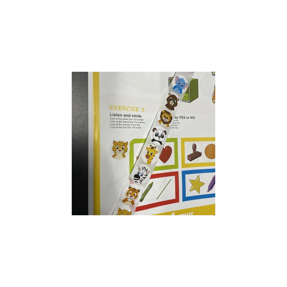 rolka z naklejkami motywacyjnymi na tle białym