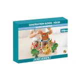 Wielokolorowe klocki do budowy domku rozłożone na stole