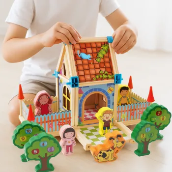 Kolorowe drewniane klocki konstrukcyjne w trakcie budowy domku