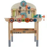 dziecko bawiące się przy stole warsztatowym kruzzel