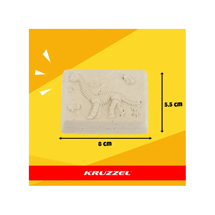 wszystkie elementy zestawu wykopalisk dinozaurów rozłożone na stole