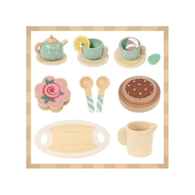 Zbliżenie na zieloną filiżankę ze spodkiem i łyżeczką z drewna