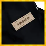 Mufki Kruzzel z widocznym zapięciem na napy do łatwego montażu