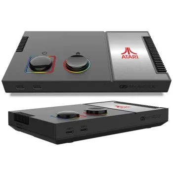 zestaw: konsola Atari, joysticki, kable i instrukcja obok siebie