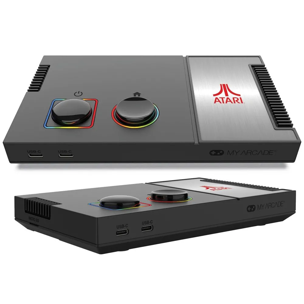 zestaw: konsola Atari, joysticki, kable i instrukcja obok siebie