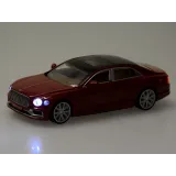 Bordowy Bentley Flying Spur Hybrid w dynamicznej pozie jazdy