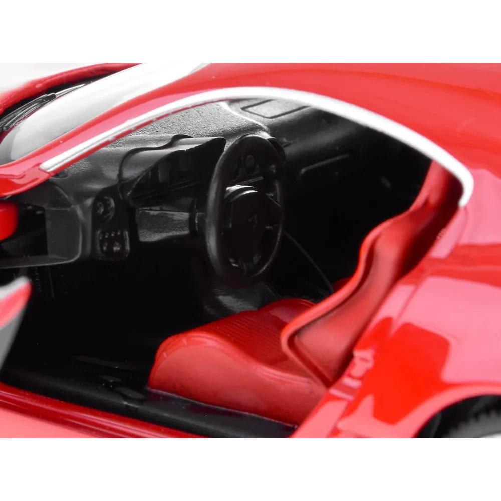 konsola ze świecącymi zegarami we wnętrzu modelu samochodu