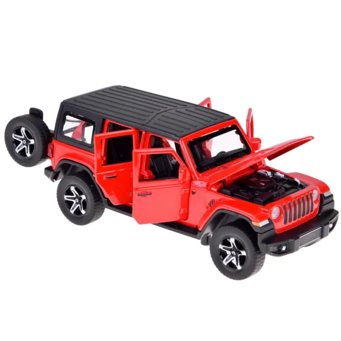 łóżko, stół i krzesła we wnętrzu przyczepy kempingowej