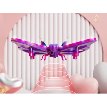 kompaktowy motyl dron gotowy do lotu pośród akcesoriów