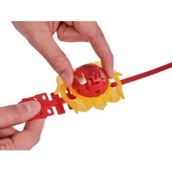 Figurka Attack Mantida Bakugan umieszczona przy pojemniku kolekcjonerskim