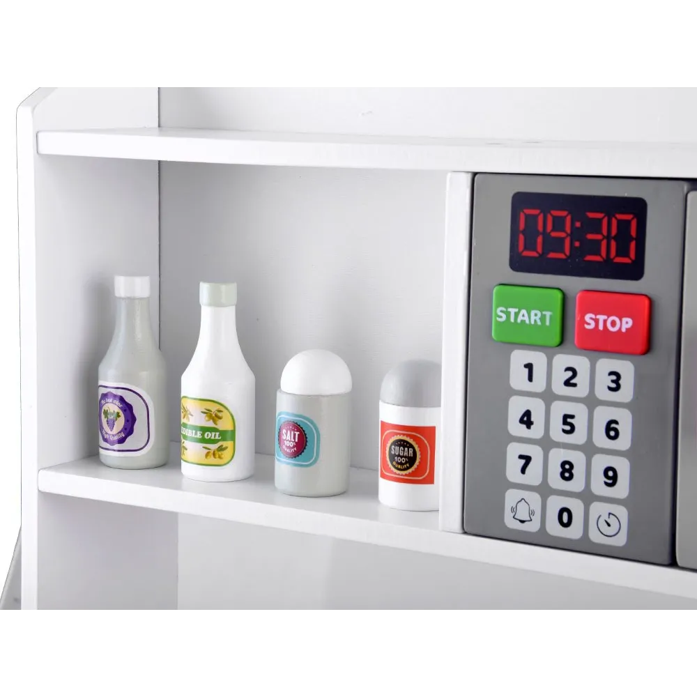 panel z pokrętłami i kranem w interaktywnej kuchni dla dzieci