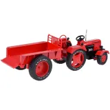 przyczepka traktora odczepiona obok pojazdu