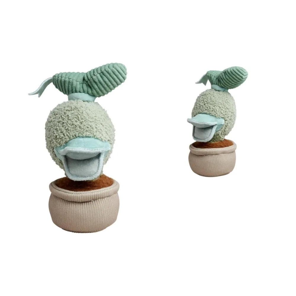 pluszowy Donald Duck w formie kwiatka na pastelowym tle