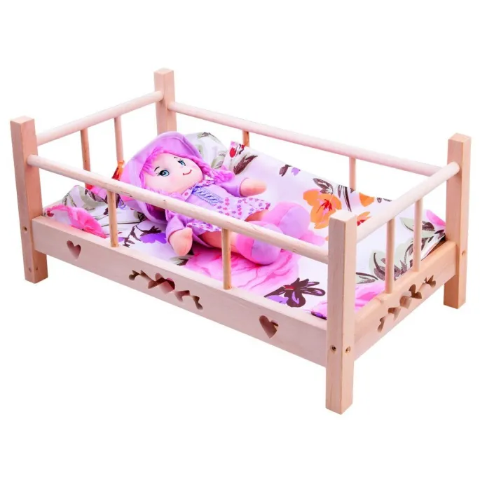 Komplet pościeli: poduszka i kołderka ułożone w łóżeczku