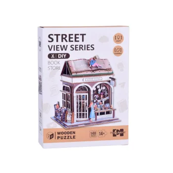 Zbliżenie na dach w kształcie otwartej książki oraz podświetlone regały